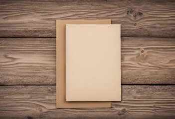 Neutral Card and Envelope on Wood Plank Background