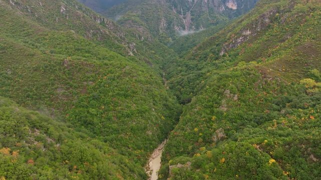 Aerial view of Acheron Springs with breathtaking canyon and river surrounded by lush forest, Epirus, Greece.
