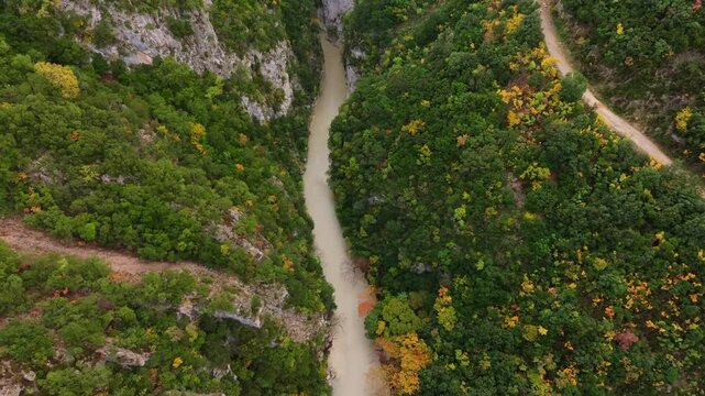 Aerial view of canyon Acheron with lush forest and serene river, Epirus, Greece.