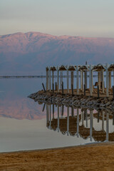 Shade structure with reflection at the beach of the Dead Sea in Israel.