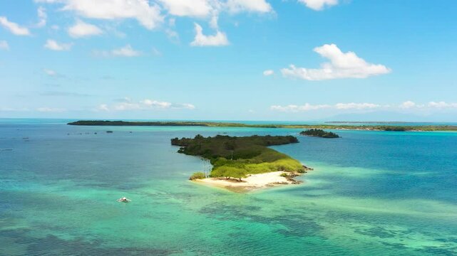 Corals and turquoise sea waters around the Islands in Bantayan, Cebu. Boat running on water. Philippines.
