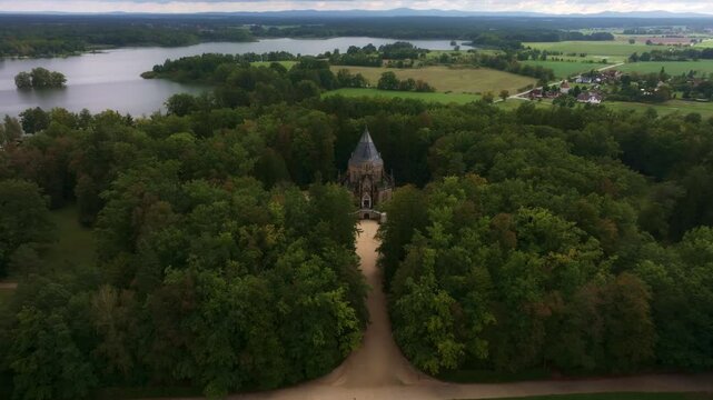 Aerial view of the serene Schwarzenberg tomb surrounded by lush forest and tranquil lake, Trebon, Czech Republic.