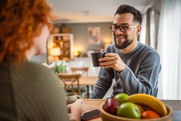 boyfriend enjoy while communicate with his girlfriend and drink coffee