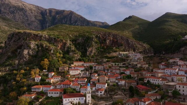 Aerial view of a picturesque village with historic stone buildings and charming rooftops nestled in the mountains, Dhermi, Albania.