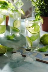 A glass with basil and lime lemonade