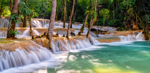 Kuang Si Waterfalls. Luang Prabang, Laos. Travel and tourism in Asia. Beautiful and largest park with cascades of waterfalls in Laos