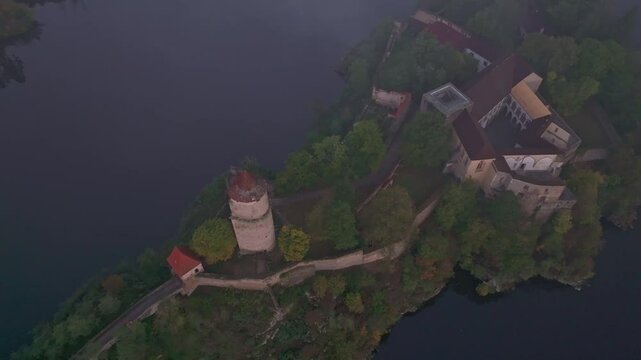 Aerial view of Zvikov Castle and the Moldau River at sunrise with serene reflections and autumn foliage, Zvikovske Podhradi, Czech Republic.