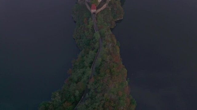 Aerial view of Zvikov Castle over the tranquil Moldau river at sunrise, Zvikovske Podhradi, Czech Republic.