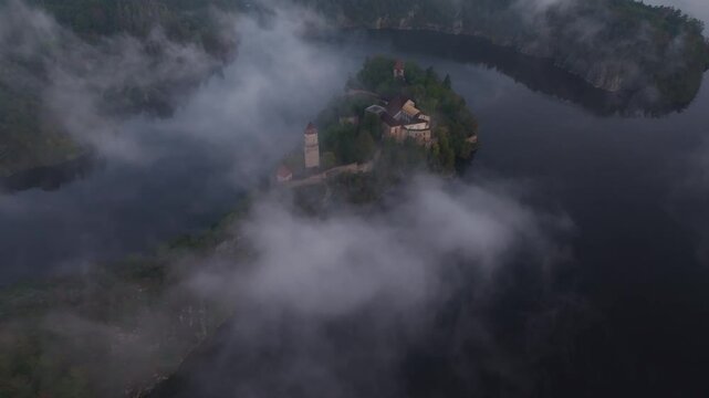 Aerial view of Zvikov Castle and the Moldau river at sunrise with mist and clouds, Zvikovske Podhradi, Czech Republic.