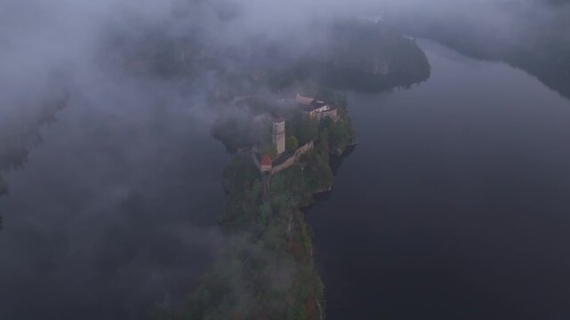 Aerial view of Zvikov Castle and the Moldau River shrouded in fog at sunrise, Zvikovske Podhradi, Czech Republic.