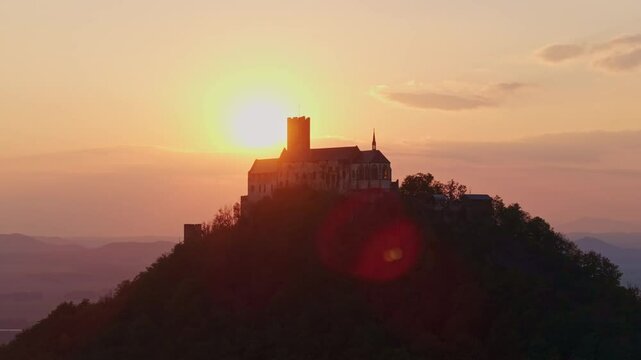 Aerial view of bezdez castle at sunset with dramatic clouds and picturesque landscape, bezdez, czech republic.