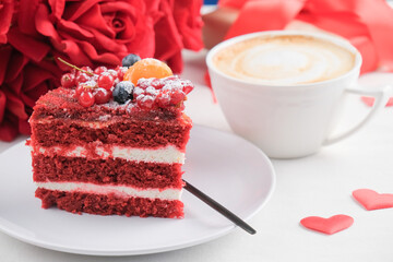 red velvet cake with fruit and coffee for valentines day on white table setting, copy space