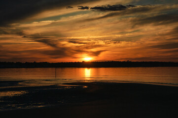 Dramatic golden sunset at Ile de Re island near La Rochelle. Charente-Maritime, Nouvelle-Aquitaine, France. Majestic nature, scenic evening landscape background.