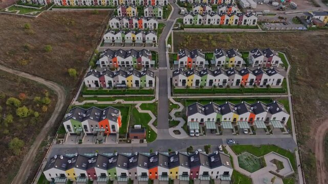 Aerial view of residential park with new houses and colorful rooftops, Lozen, Bulgaria.