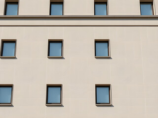 Obraz premium Modern Minimalist Building Exterior with White Facade and Windows