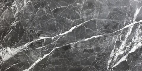 A contemporary stone wall interior featuring a grey marble texture accented by white veins, this natural granite marble tile serves as an appealing background and material.