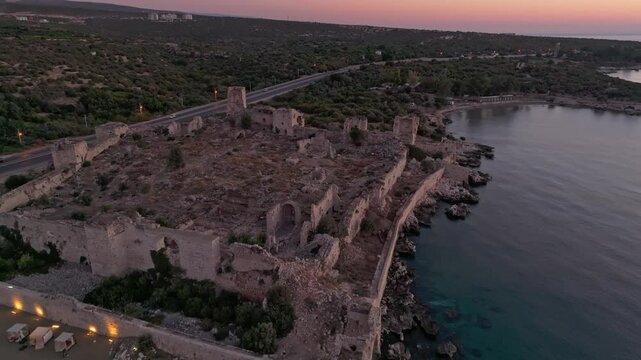 Aerial view of antik kiz kalesi ruins at sunrise over the mediterranean sea, kizkalesi, turkey.