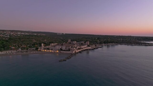 Aerial view of Antik Kiz Kalesi at sunrise with the Mediterranean Sea and coastline, Kizkalesi, Turkey.