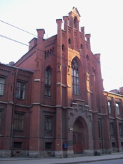 Gloomy red building in the city of St. Petersburg. Architecture.