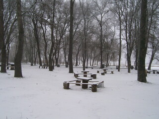 place to relax in the park. tables and benches. No visitors, deserted.