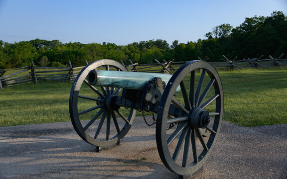 12 pounder bronze smooth bore, Napoleon Model 1857 at Gettysburg National Military Park, Pennsylvania. Battlefield in the background.
