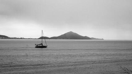 Boat on the sea with mountain backdrop
