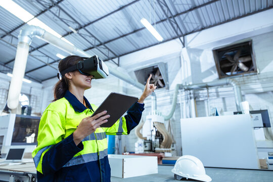 Modern Factory Innovation Technology in Industry, Technician using VR Virtual Reality Headset