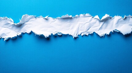 Crumpled white paper strip on vibrant blue background creating a textured contrast