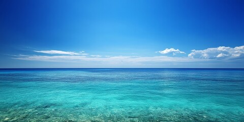 Vibrant sea under a clear blue sky creates a stunning backdrop, showcasing the beauty of the sea and its tranquil atmosphere, perfect for capturing the essence of the sea in photographs.