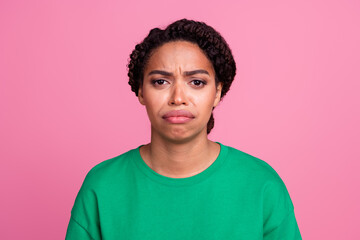 Photo portrait of attractive young woman sad stressed face dressed stylish green clothes isolated on pink color background