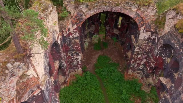 Aerial view of the historic ruins of St. Jana Krtitele church surrounded by overgrown greenery, Kocov, Czech Republic.