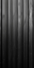 Corrugated black steel texture. Durable, ridged metallic surface with dark tones.