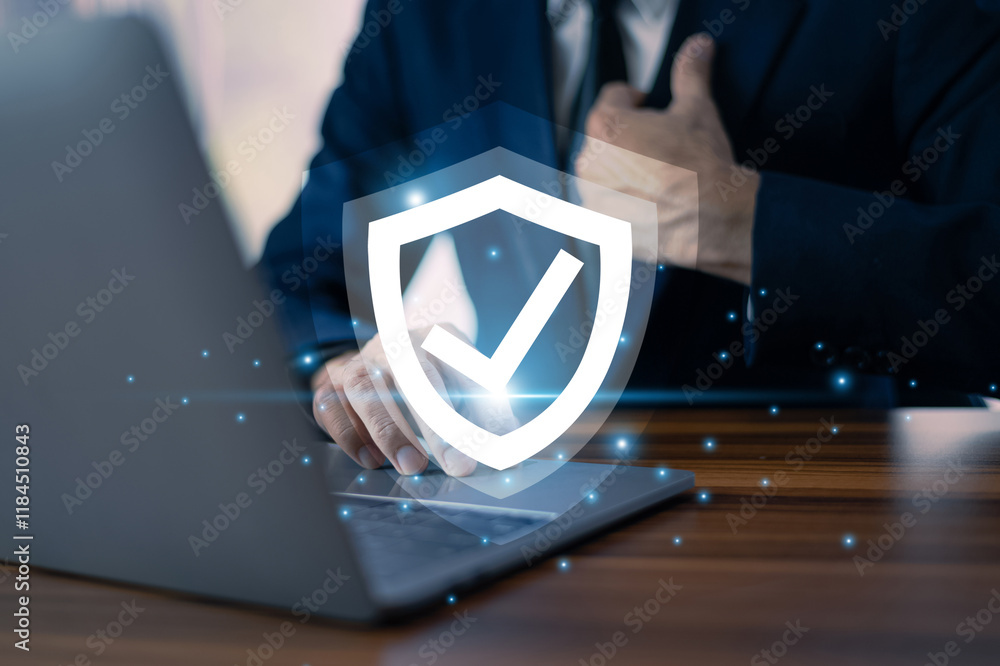 Poster businessman working on a laptop with advanced cyber security shield, ensuring the protection of sens