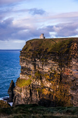 Grass, sky, rain, waves, cloudy, Cliffs of Moher at sunset, Co. Clare, Ireland. Sunse, perfect...