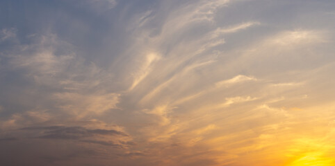 Bright orange sky at sunset, the sun on the evening horizon
