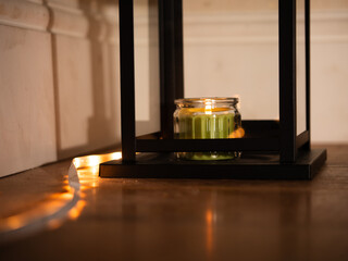 Candle burning in lantern