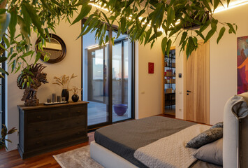 A modern bedroom that seamlessly incorporates natural elements with sleek contemporary design