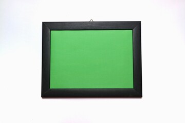 Wooden frame with green surface isolated on white background. copy space for text