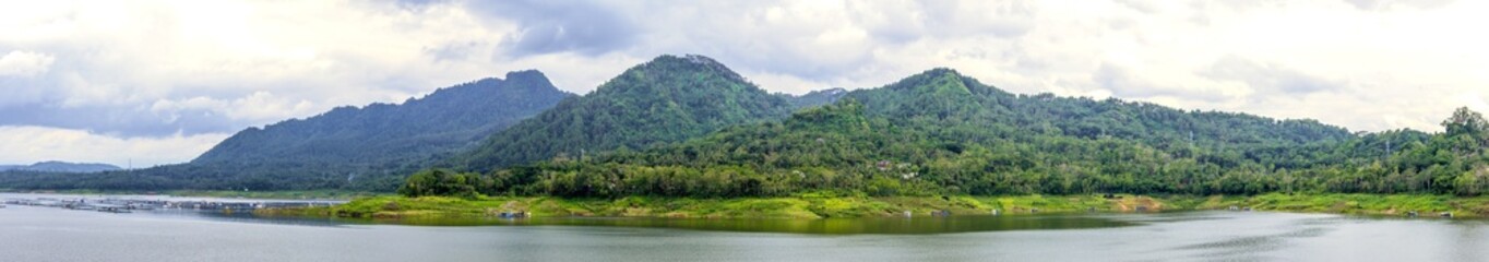panoramic view of beautiful mountain lake located in Indonesia. The mountain, lake and cloudy sky panorama