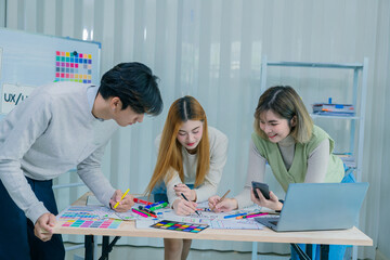 Application development UI UX web designer team is working together to develop a mobile responsive...