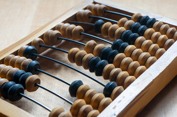 Antique wooden abacus on a wooden table