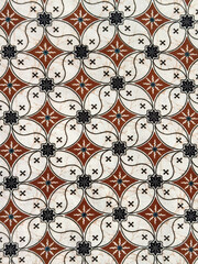 Pattern of coffee bean diamond floral shape. One of traditional cloth or Batik pattern from ethnic Indonesia. Curved floral diamond pattern repeated. Wall covering or fabric. Seamless texture