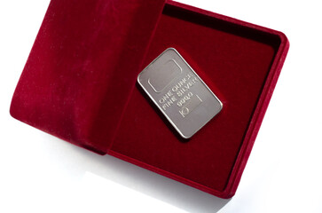 One troy ounce silver bar in a red velvet gift box.