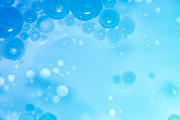 Blue Water Bubbles and Air Bubbles Floating in a Soft Background