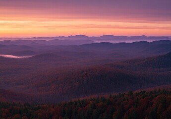 A beautiful mountain range with a purple sky in the background