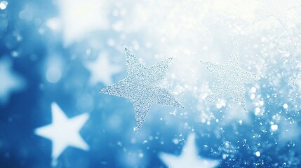 Sparkling silver stars on a bright blue bokeh background.