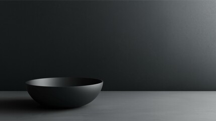 Minimalist Black Bowl on Textured Surface
