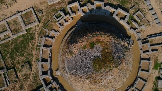 Aerial view of ancient ruins and stone structures at Dharmarajika Stupa, Taxila, Pakistan.
