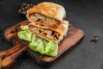 donner kebab chicken and vegetables shawarma sandwich tortilla meat filling fast food flatbread fresh tasty food dish delicious gourmet food background on the table rustic food top view copy space