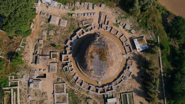 Aerial view of Dharmarajika Stupa and ancient ruins at an archeological site, Taxila, Pakistan.